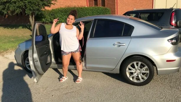 Amy with her repaired car